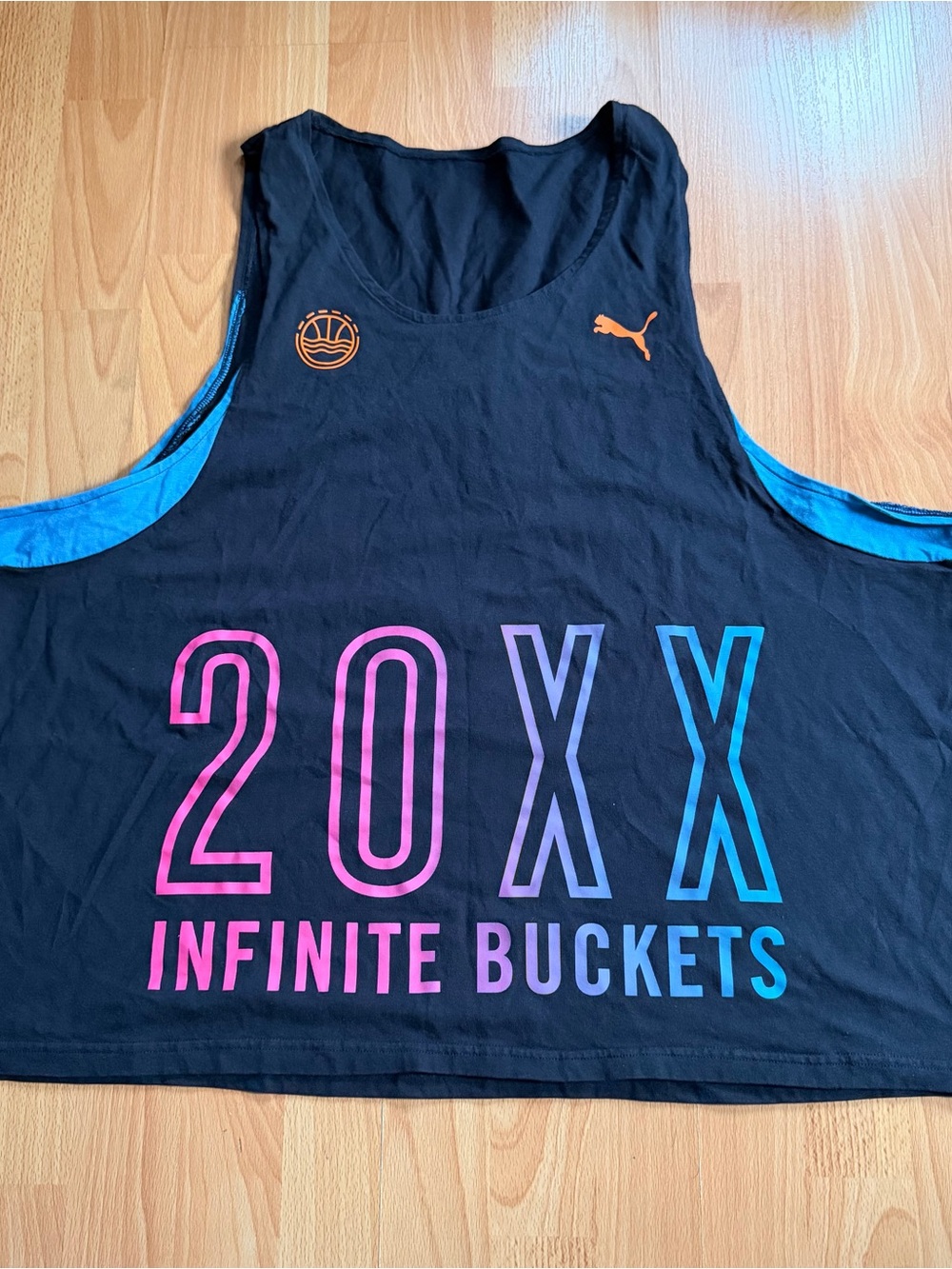 PUMA Black Tank Top with Colorful 20XX Infinite Buckets Graphic.